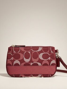 Coach Wine Metallic Signature C Striped Wristlet featuring signature “C” EUC
